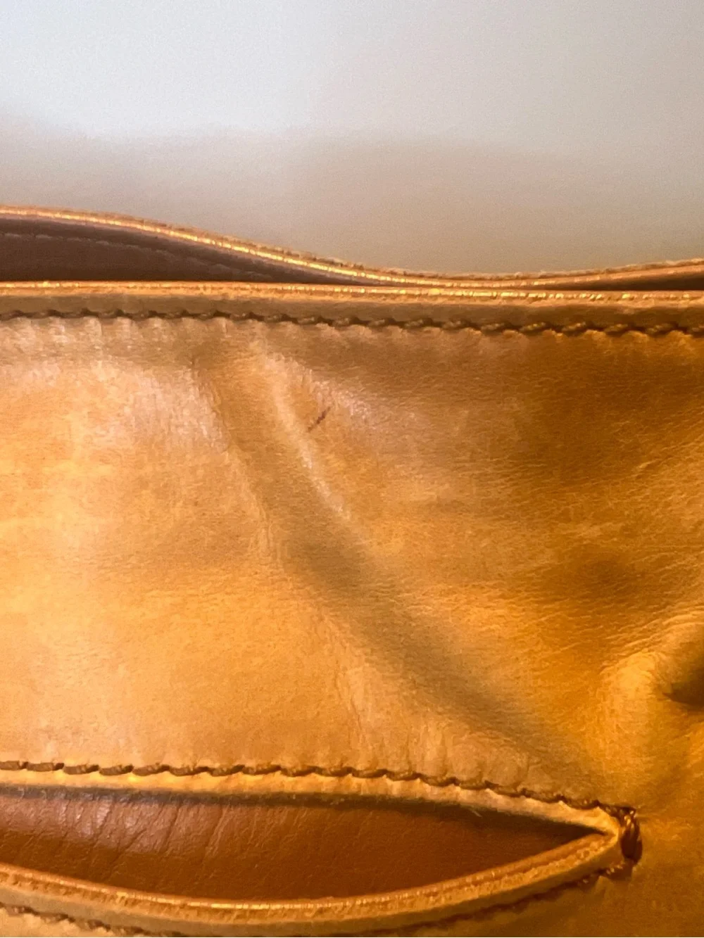 The Sak tan leather crossbody with beige interior